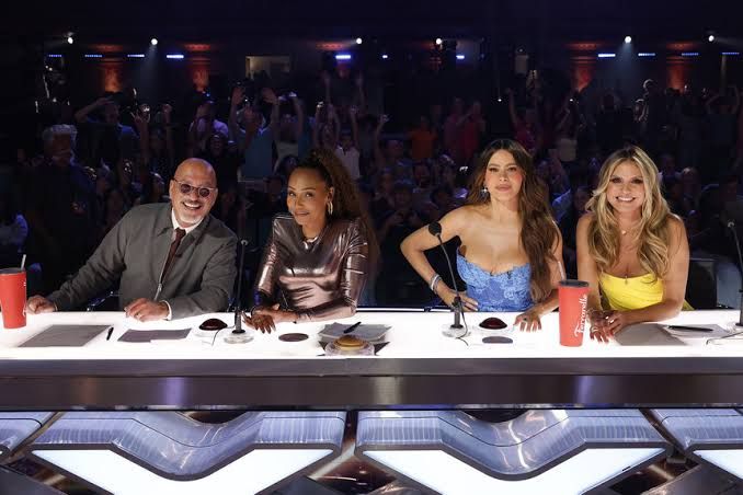 Judges Howie Mandel, Mel B, Sofia Vergara, and Heidi Klum sit at the judges' table during the AGT Quarterfinals.