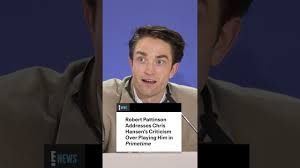 Robert Pattinson mimicking the investigative style of Chris Hansen in a dark, television-style interview setting.