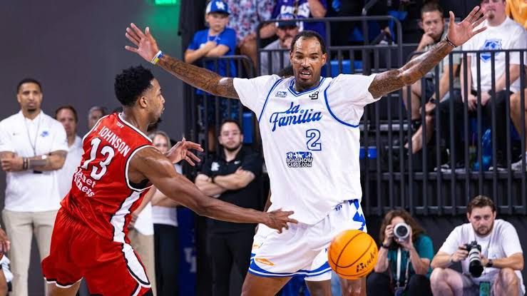 Jon Hood watches Andrew Harrison maneuver the ball against The Ville at Historic Memorial Coliseum.