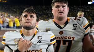 Western Michigan Broncos player reacting on the field during the final seconds of their game against Michigan.