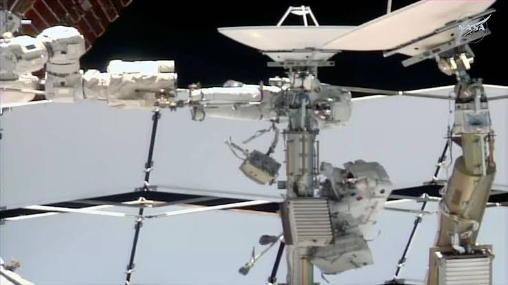 Anil Menon and Sophie Adenot working on a failed Space-to-Ground antenna at the ISS Z-1 truss.