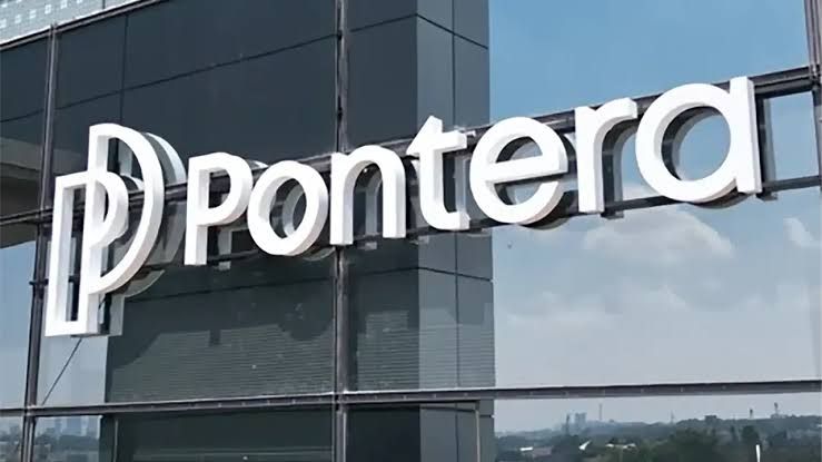 Pontera branding sign on a desk inside a modern office setting.