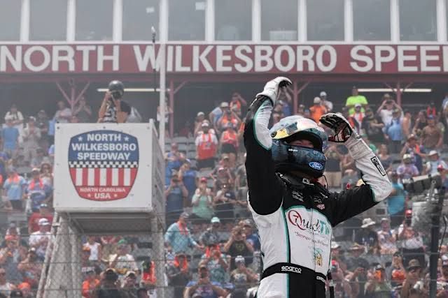Chandler Smith driving the Front Row Motorsports truck to victory at North Wilkesboro Speedway.