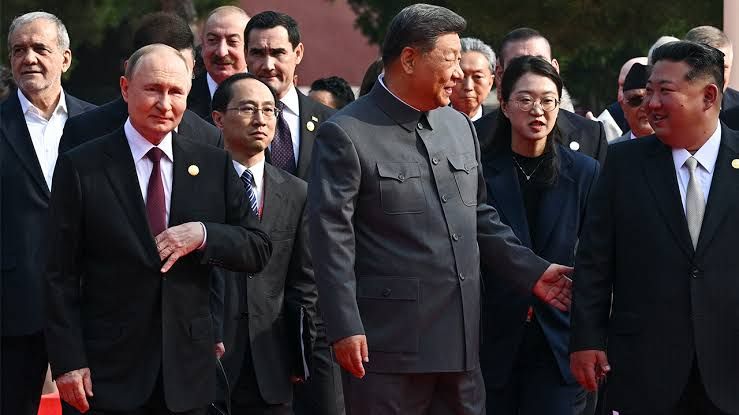 A graphic collage of the leaders of Russia, China, North Korea, and Iran meeting during a military ceremony in Beijing.
