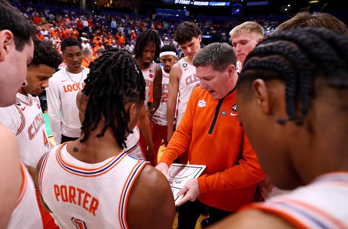 Clemson head coach Brad Brownell coaching from the sidelines during a high-stakes ACC basketball game.