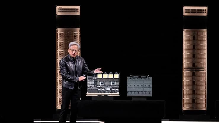 Jensen Huang presenting the Vera Rubin Ultra compute tray at the Nvidia GTC conference.