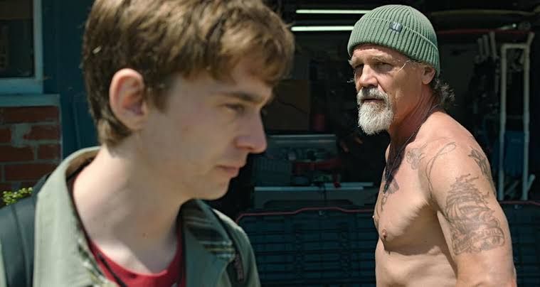 Josh Brolin and Austin Abrams appear together on screen in a scene from the 2026 film Whalefall.