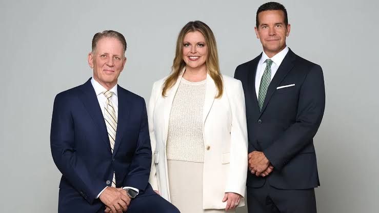 Advisors Jeffrey Thompson, Sara DeJay Willis and Shannon Willems standing together at the new NewEdge Wealth office.
