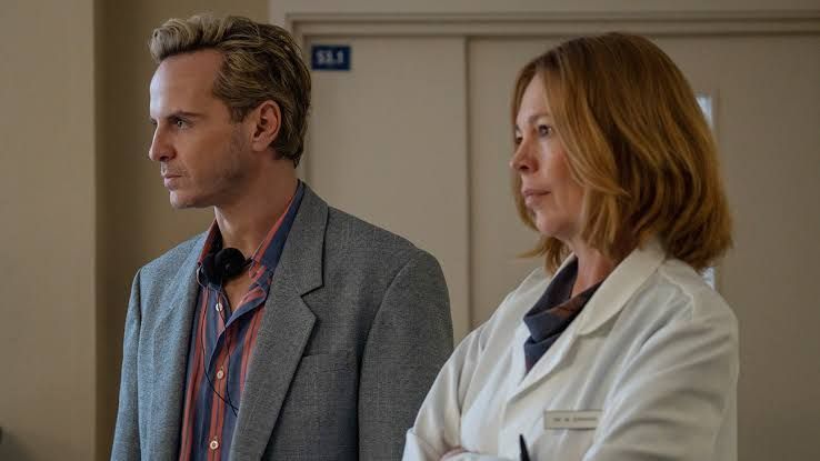 Andrew Scott as Ian Charleson and Olivia Colman as Dr. Johnson standing together in a scene from the film Elsinore.