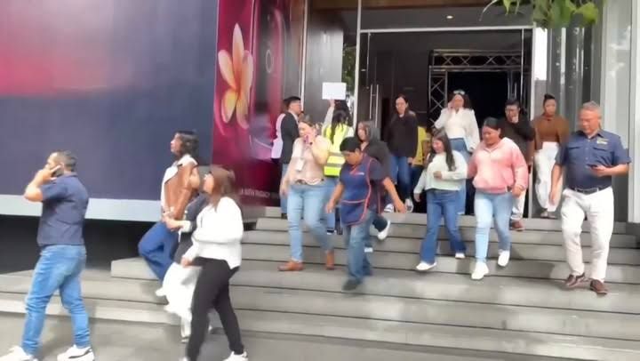 People evacuating buildings in Guatemala City following a 7.3 magnitude earthquake on the Mexico border.