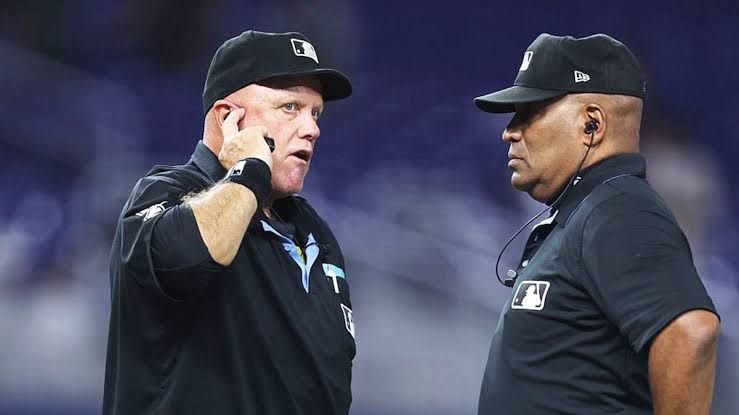 St. Louis Cardinals manager Oliver Marmol arguing with home plate umpire CB Bucknor during an MLB game.