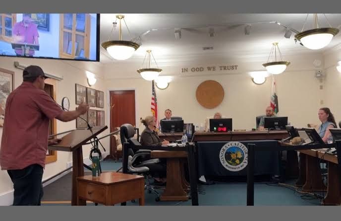 Supervisor Mike Holland addresses the Sonora City Council during a meeting regarding county-city relations.