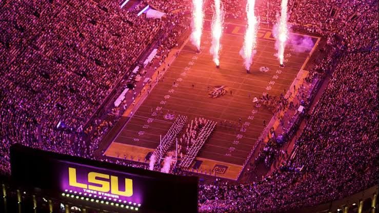 LSU Athletics officials and Rev Fiber representatives at a press event inside Tiger Stadium.