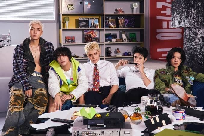 NCT 127 members posing for promotional artwork for their seventh full-length album, BLINGY.