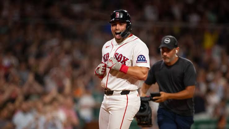 Caleb Durbin rounding the bases after hitting a go-ahead home run for the Red Sox at Fenway Park.