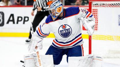 Jack Campbell standing on the ice in his goaltending gear during an NHL game.