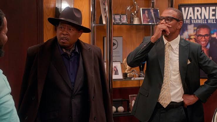 Martin Lawrence and Tommy Davidson stand together in a studio setting for The Varnell Hill Show.