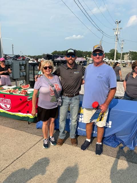 NASCAR driver Ross Chastain signs an autograph for a fan at the Delaware State Fair to promote sober driving safety.