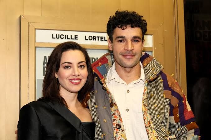 Actors Aubrey Plaza and Christopher Abbott standing together at a public event.