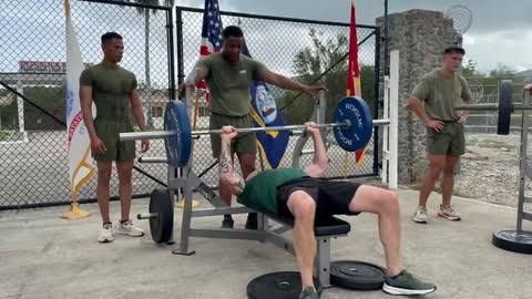 Defense Secretary Pete Hegseth performing a pull-up during a military exercise video.