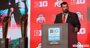 Ryan Day speaking at a podium during the Big Ten Media Days event in Indianapolis.