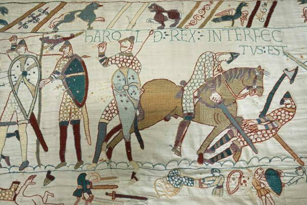 The 70-meter-long Bayeux Tapestry displayed in a glass case at the British Museum in London during a press preview.
