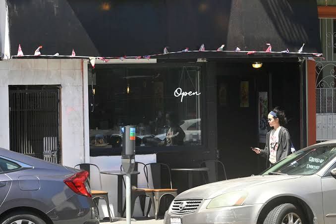 Lyndsey Lozano stands inside the Grind and Unwind restaurant on Haight Street in San Francisco.