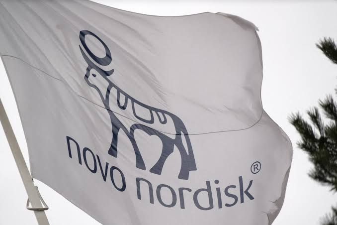 Novo Nordisk logo displayed next to a Wegovy injection pen used for weight management.