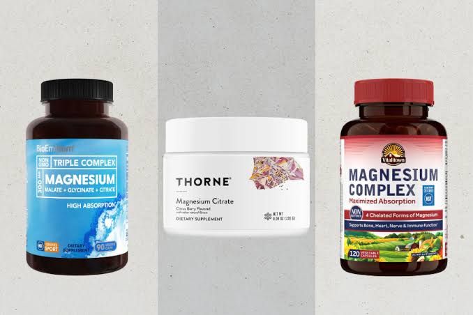 Close up of various magnesium supplement bottles on a store shelf.