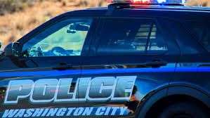 Washington City Police patrol vehicle parked on a street during a police investigation.