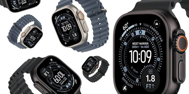 Close up of an Apple Watch Ultra 3 featuring a titanium case and blue ocean band.