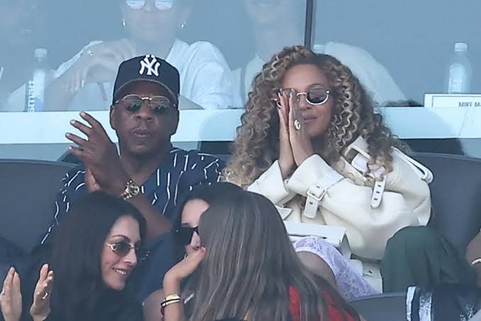 Jay-Z and Beyoncé watch the FIFA World Cup 2026 final match between Spain and Argentina in the stadium stands.
