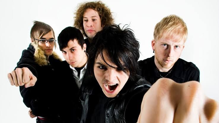 My Chemical Romance band members posing together in London for a promotional photo.