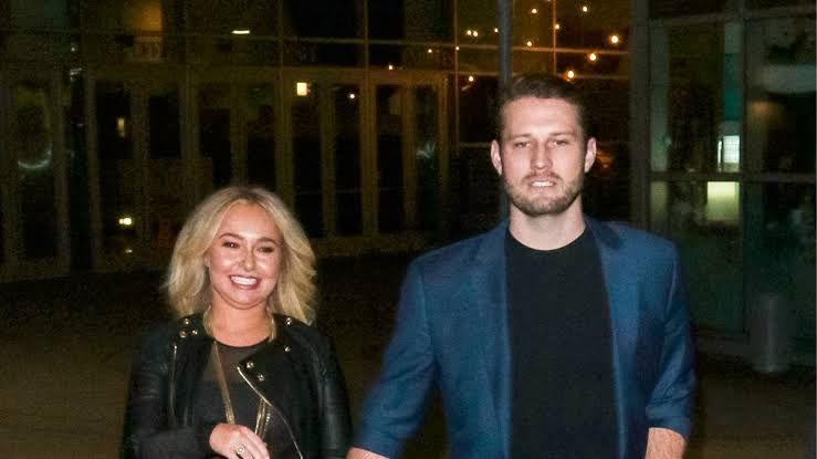 Brian Hickerson and Hayden Panettiere posing for a photograph during a public event.