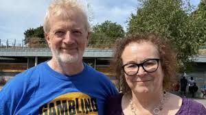 Charles and Liz Ritchie standing together at the William Ramsay Cup football tournament in Sheffield.