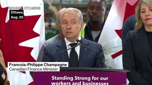 Finance Minister Francois-Philippe Champagne speaking at a press event regarding current trade negotiations.