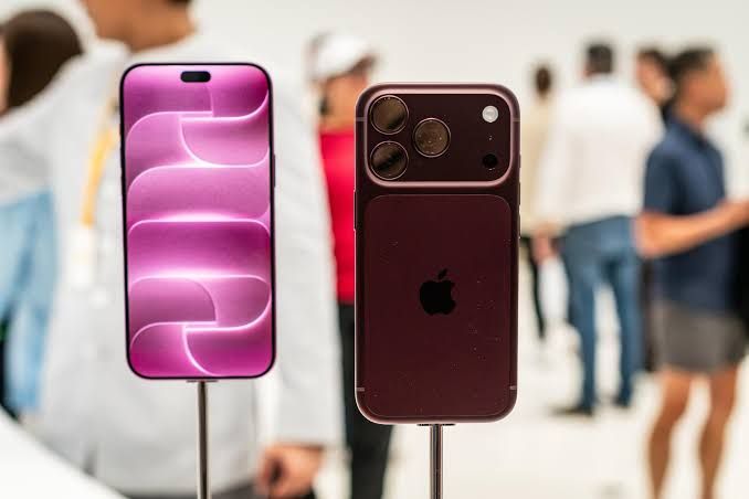 iPhone 18 Pro models in various colors displayed on a clean surface at the Apple product launch event.
