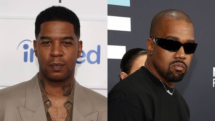 Kid Cudi and Kanye West performing together on stage during a concert in Chicago.