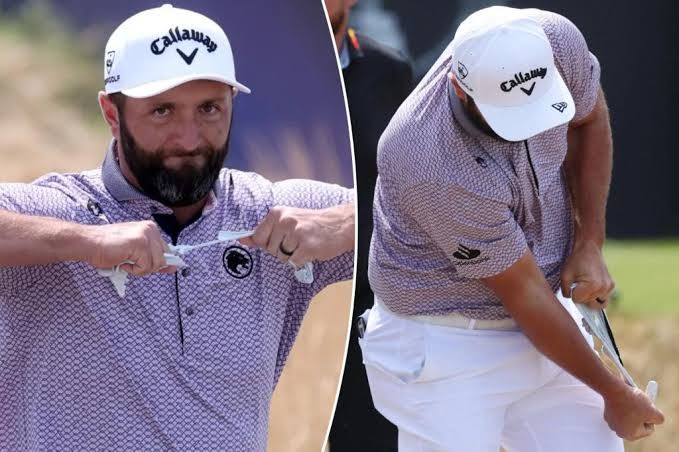 Jon Rahm tearing his glove apart while walking off the first tee box during the final round of the British Open.