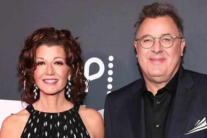 Amy Grant and Vince Gill standing together at a Nashville event.