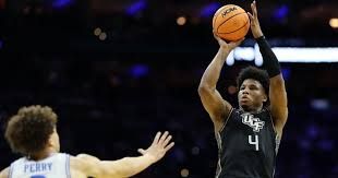UCF forward Jamichael Stillwell shooting the ball against UCLA during the 2026 NCAA Tournament first round game.