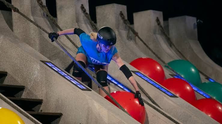 Deb Chubb and Reilly Smedley stand on a set during The Challenge Season 42 elimination round.