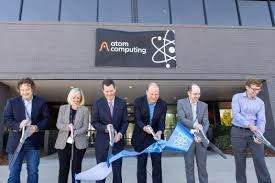 Rob Hays and state officials cutting the ribbon at an Atom Computing facility in Boulder, Colorado.