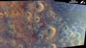 Enhanced-color mosaic of the cratered surface of Mars captured by NASA's Psyche spacecraft on May 15, 2026.