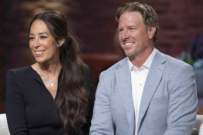 Joanna and Chip Gaines smiling together during a public appearance.