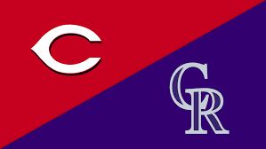 Spencer Steer hitting his second home run of the game at Coors Field during the Reds vs. Rockies match.