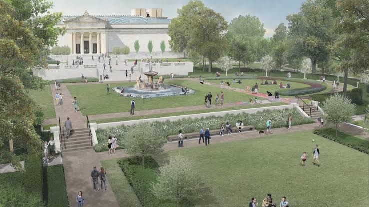 People walking along paths in the Fine Arts Garden on the grounds of the Cleveland Museum of Art.
