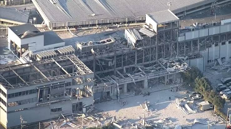Emergency workers search for survivors among the rubble of the damaged Aeon Mall in Kumamoto, Japan.