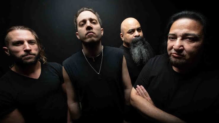 Fear Factory posing for a professional band photograph during their 2026 promotional cycle.