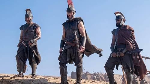 Matt Damon and other actors featured in Christopher Nolan's film The Odyssey on a theatrical poster.